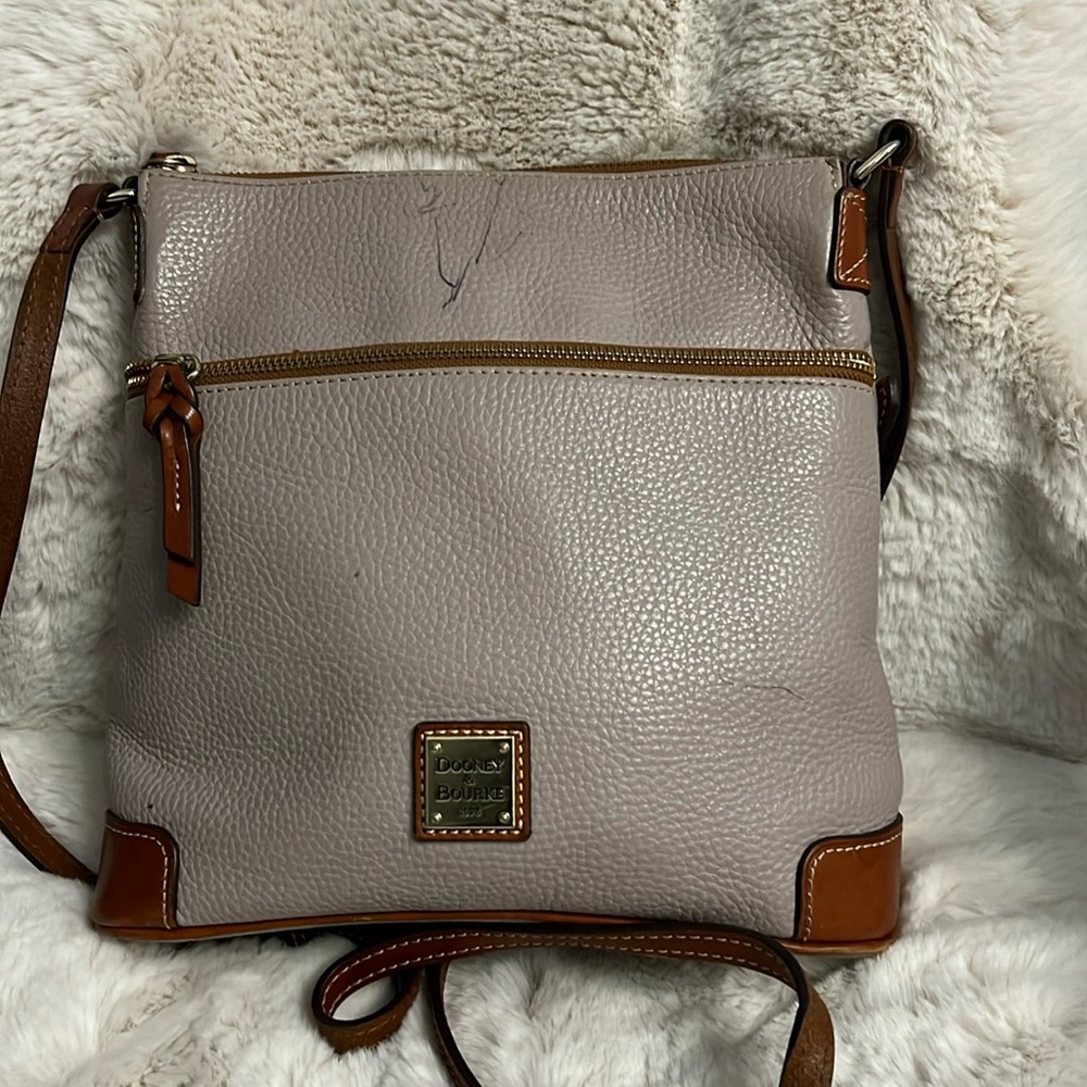 Dooney and Bourke pebbled leather Crossbody shoulder bag(appears lavender)/brown